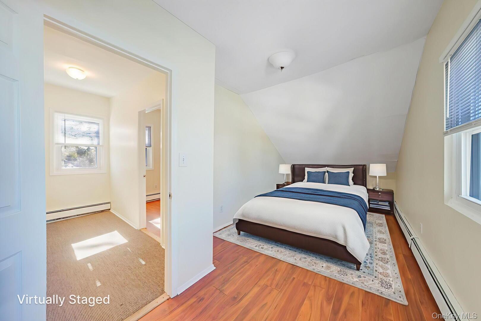 39 Chapman Place, Unit 2 Bay Shore, NY 11706 - Photo 12 of 17 a bedroom with a bed and a view of walk in closet