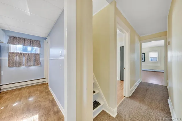 a view of a hallway with a dining table and closet