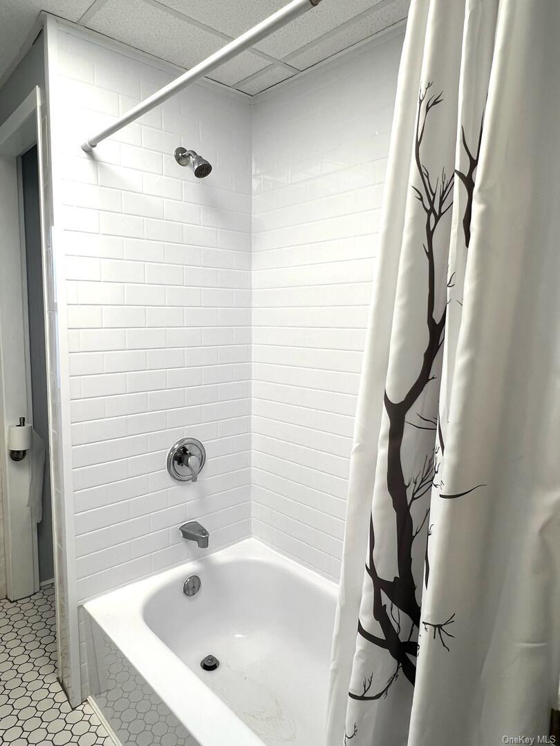 39 Chapman Place, Unit 2 Bay Shore, NY 11706 - Photo 10 of 17 a bathroom with a bathtub and shower