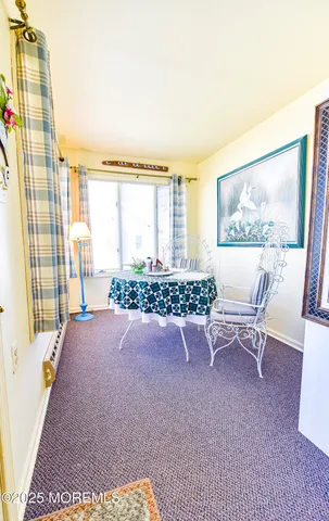 a view of living room with furniture and flat screen tv