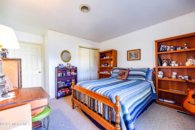 a spacious bathroom with a tub sink and mirror