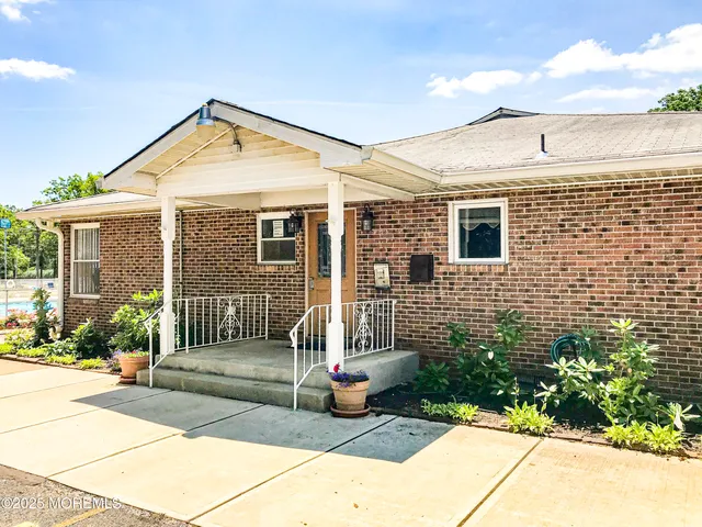 a swimming pool with an outdoor seating