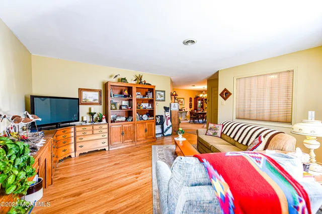 a bed room with furniture and a book shelf