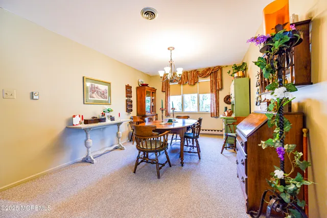 a kitchen with sink refrigerator and cabinets