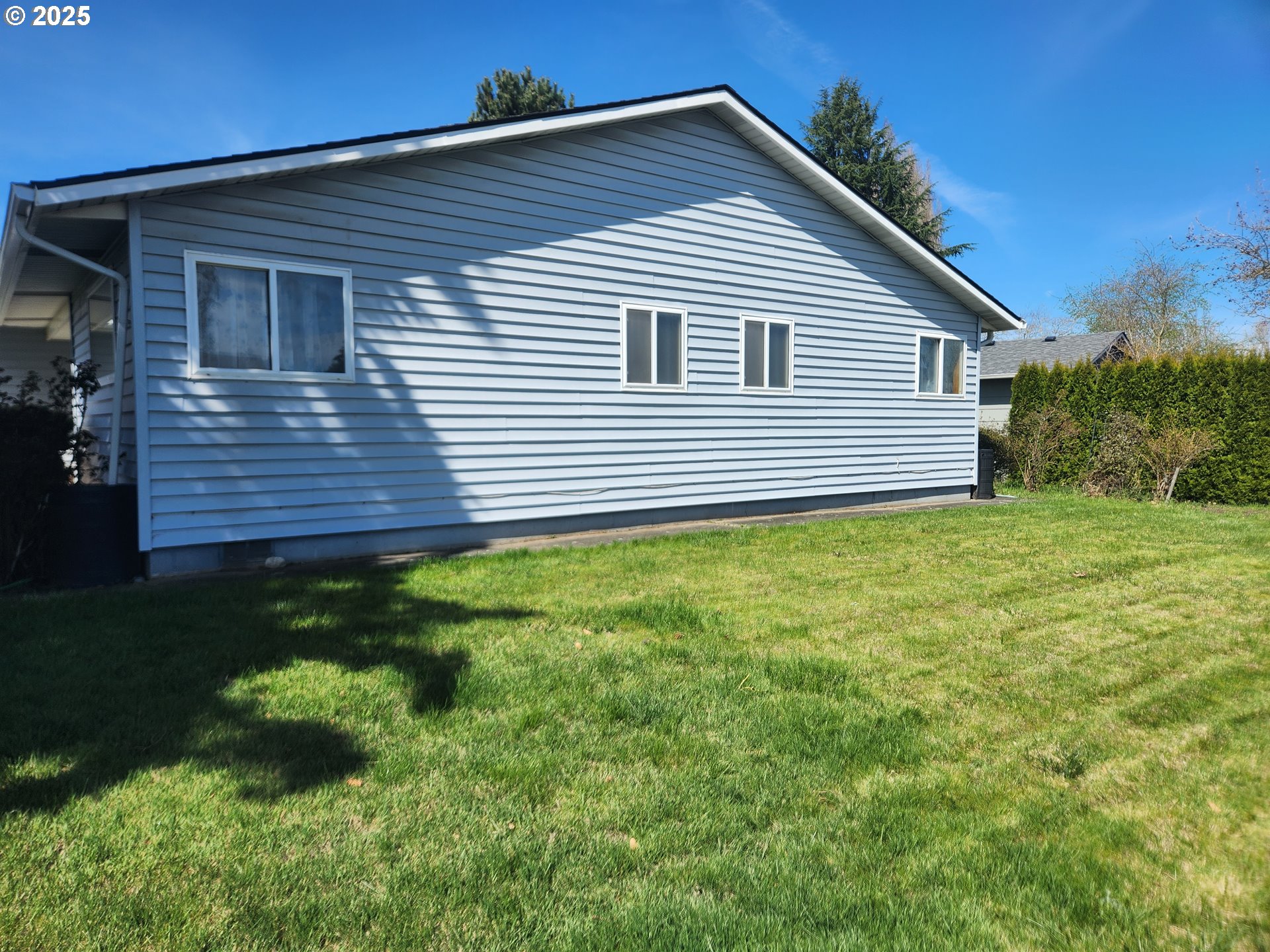 2207 Oregon Court Woodburn, OR 97071 - Photo 16 of 27 a view of a house with a yard