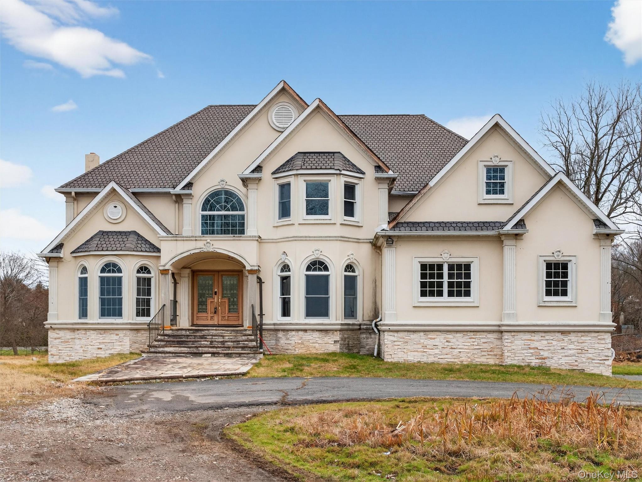 a front view of a house with a yard