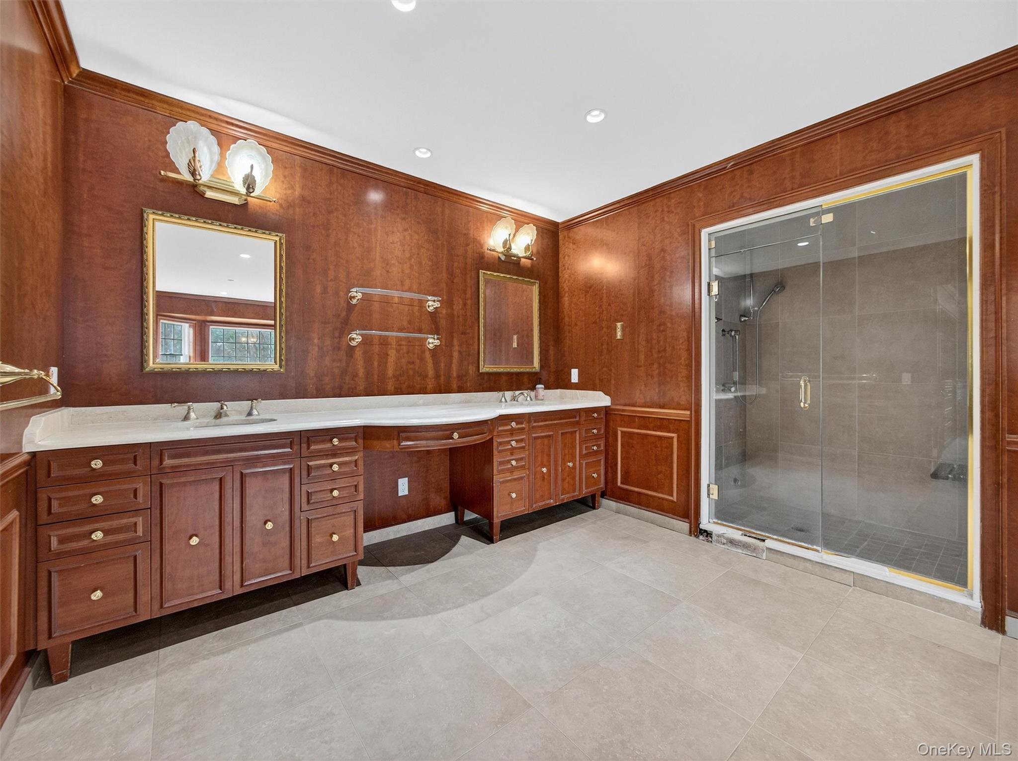120 East Willow Tree Road Spring Valley, NY 10977 - Photo 24 of 49 Bathroom with double vanity, a stall shower, crown molding, wooden walls, and recessed lighting