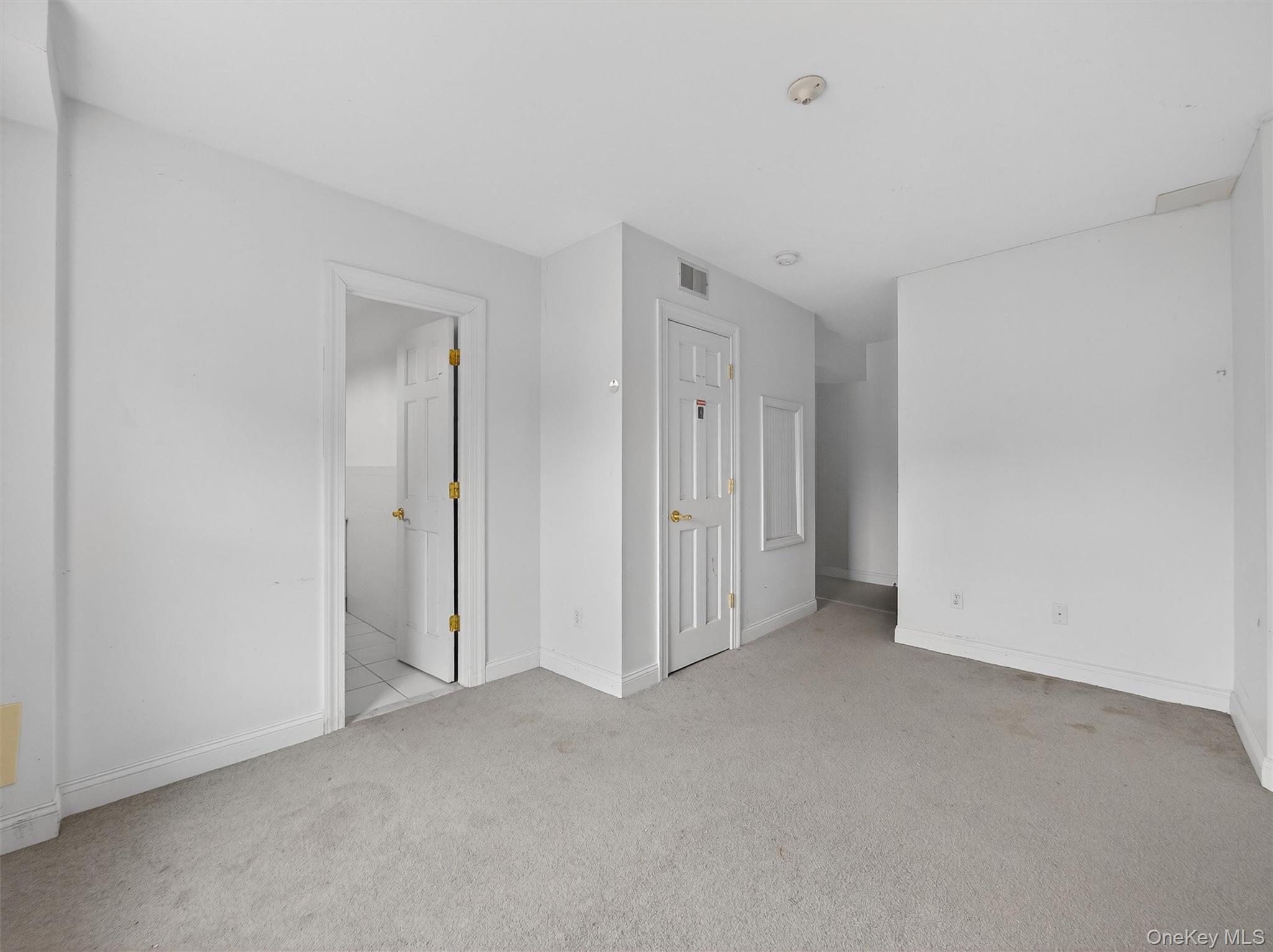 120 East Willow Tree Road Spring Valley, NY 10977 - Photo 35 of 49 Unfurnished bedroom featuring carpet floors and baseboards