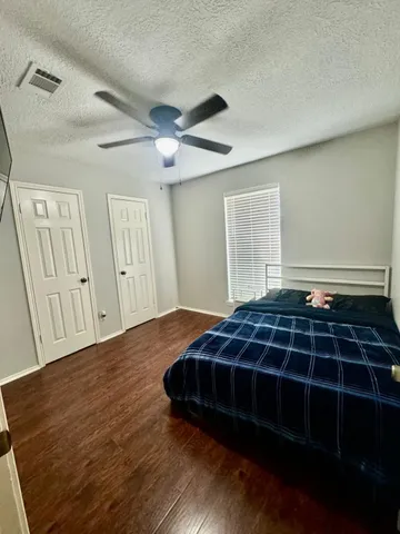 a room with pool table and windows