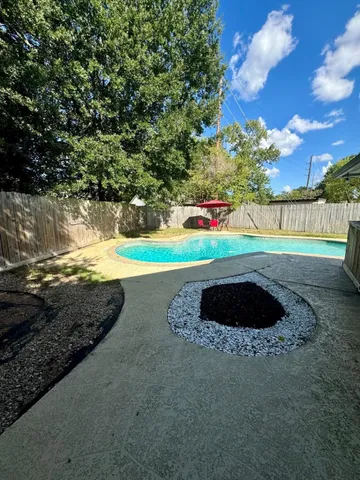 a view of outdoor space yard and swimming pool