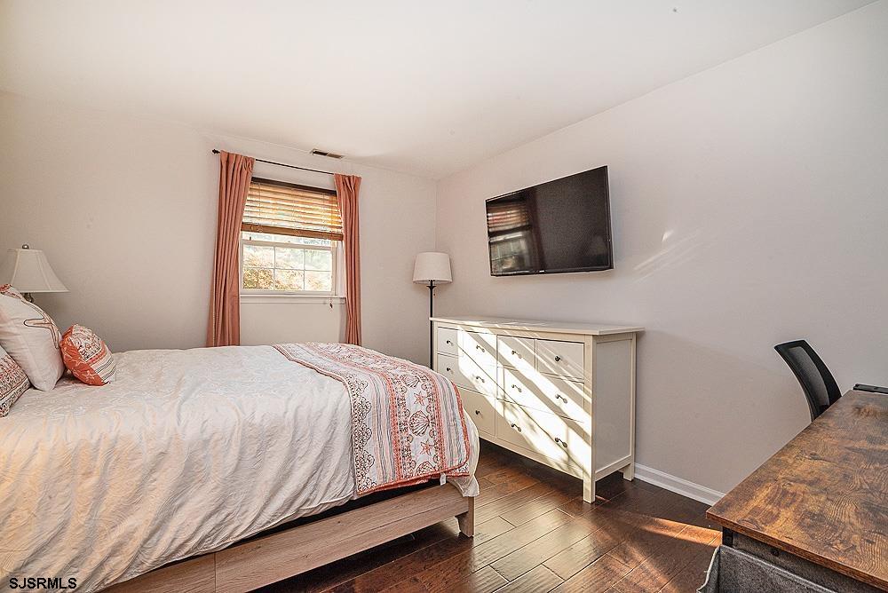 68 Defeo Lane Somers Point, NJ 08244 - Photo 20 of 44 a bedroom with a bed and a flat screen tv