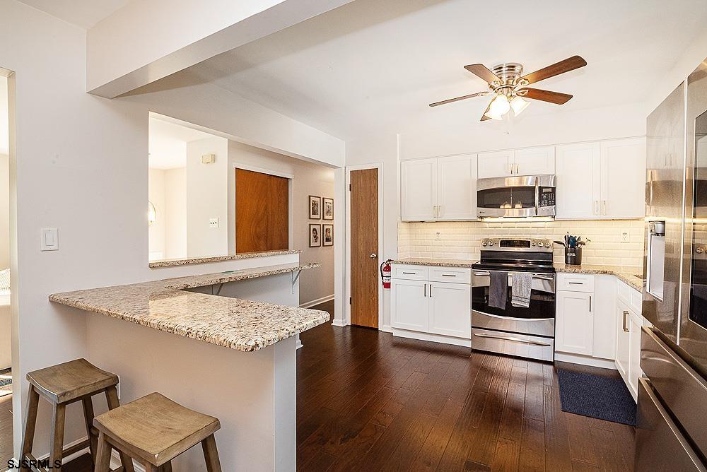 68 Defeo Lane Somers Point, NJ 08244 - Photo 2 of 44 a kitchen with a stove a sink and a refrigerator