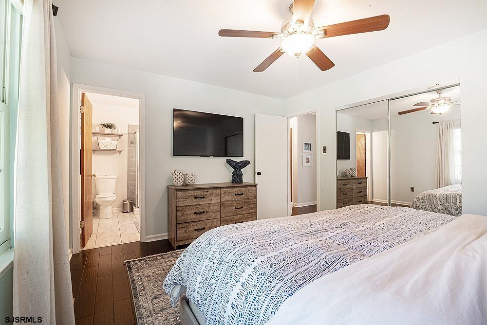 68 Defeo Lane Somers Point, NJ 08244 - Photo 23 of 44 a bedroom with a bed and a flat screen tv