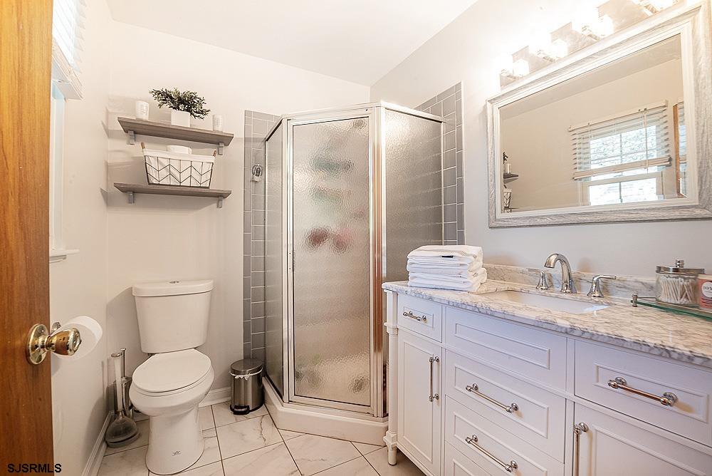 68 Defeo Lane Somers Point, NJ 08244 - Photo 29 of 44 a bathroom with a granite countertop toilet sink and shower