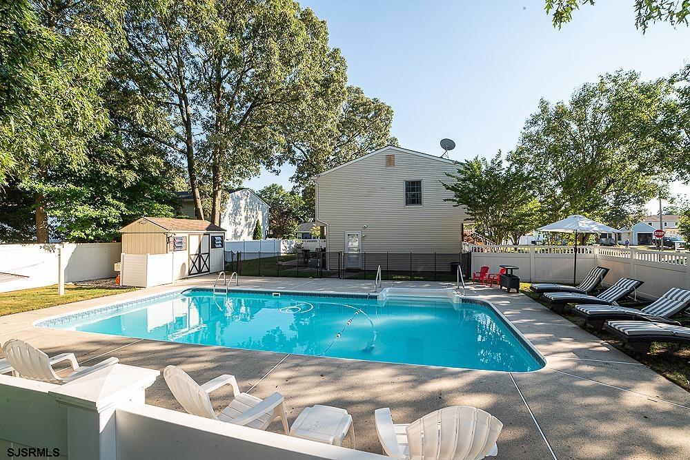 68 Defeo Lane Somers Point, NJ 08244 - Photo 32 of 44 a view of a swimming pool with a patio