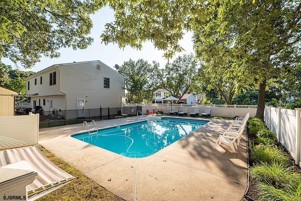 68 Defeo Lane Somers Point, NJ 08244 - Photo 35 of 44 a view of a swimming pool with a patio