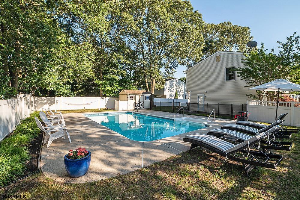 68 Defeo Lane Somers Point, NJ 08244 - Photo 36 of 44 a view of a swimming pool with a patio