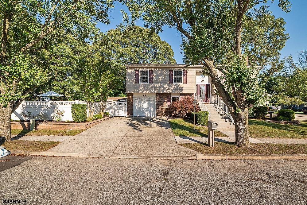 68 Defeo Lane Somers Point, NJ 08244 - Photo 41 of 44 a front view of a house with a yard