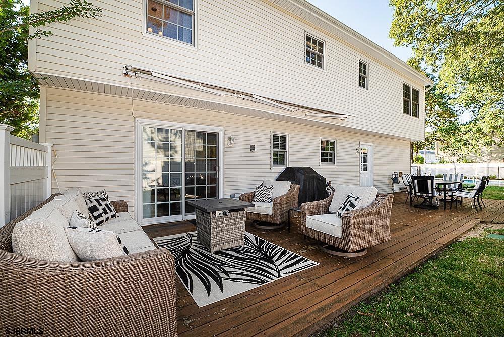 68 Defeo Lane Somers Point, NJ 08244 - Photo 43 of 44 a view of a patio with couches chairs and a dining table