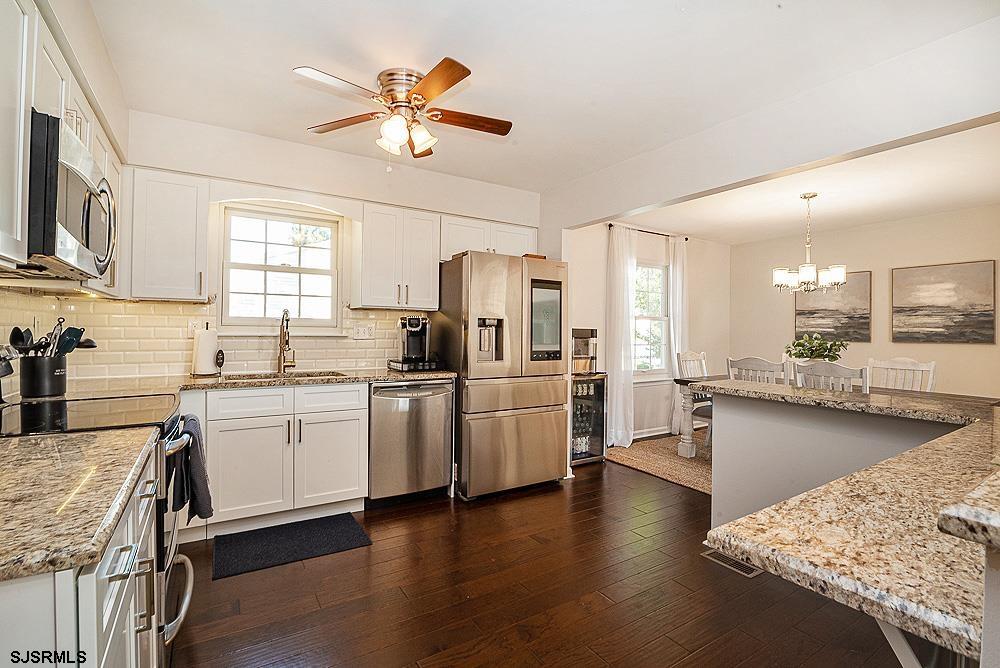 68 Defeo Lane Somers Point, NJ 08244 - Photo 5 of 44 a kitchen with a sink appliances and cabinets