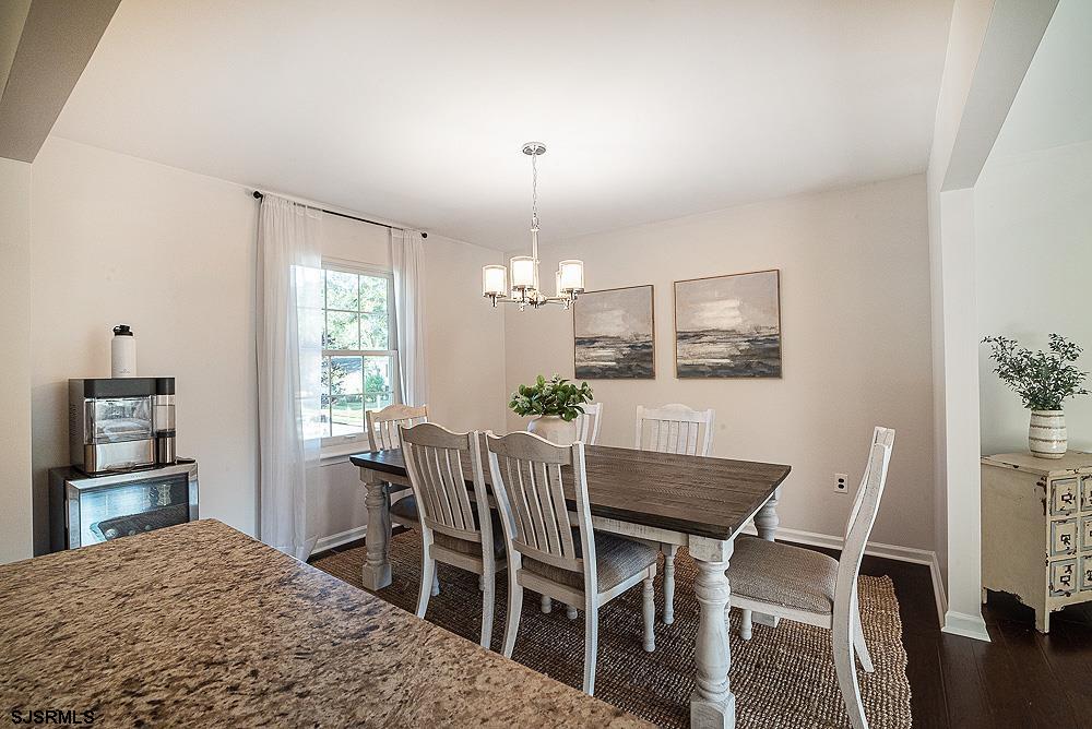 68 Defeo Lane Somers Point, NJ 08244 - Photo 8 of 44 a view of a dining room with furniture and a chandelier