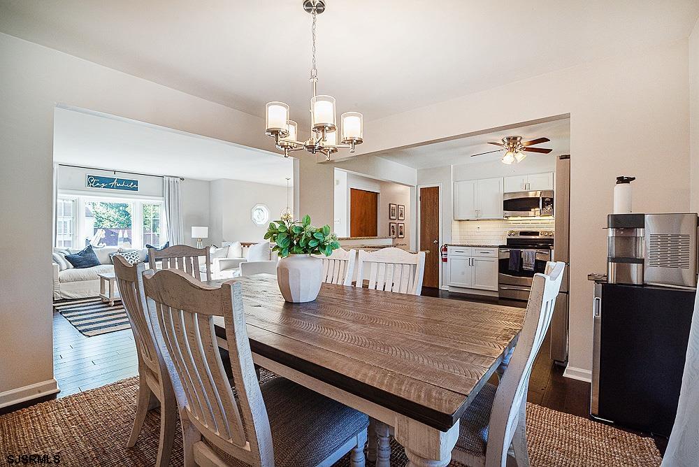68 Defeo Lane Somers Point, NJ 08244 - Photo 10 of 44 a view of a dining room with furniture window and wooden floor