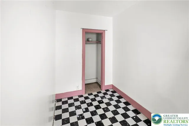 a bathroom with a sink and a window