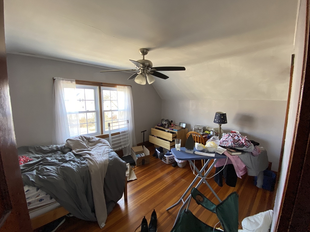 55 Cherry Street, Unit 55 Medford, MA 02155 - Photo 2 of 9 a bed room with a bed and a window