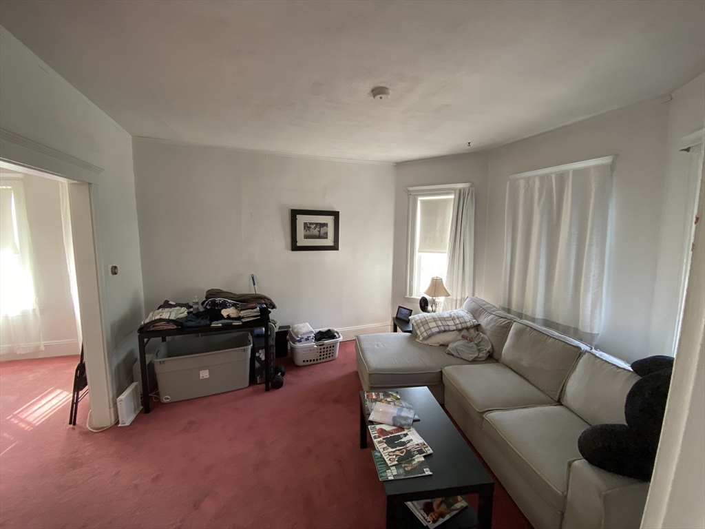55 Cherry Street, Unit 55 Medford, MA 02155 - Photo 4 of 9 a living room with furniture and a window
