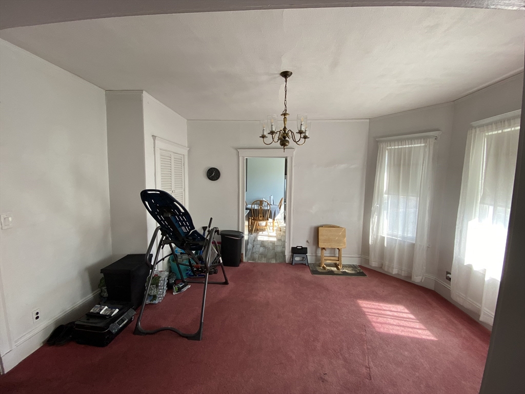 55 Cherry Street, Unit 55 Medford, MA 02155 - Photo 9 of 9 a room with gym equipment and wooden floor