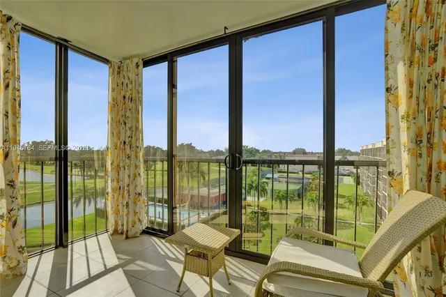 a living room with couches and ocean view