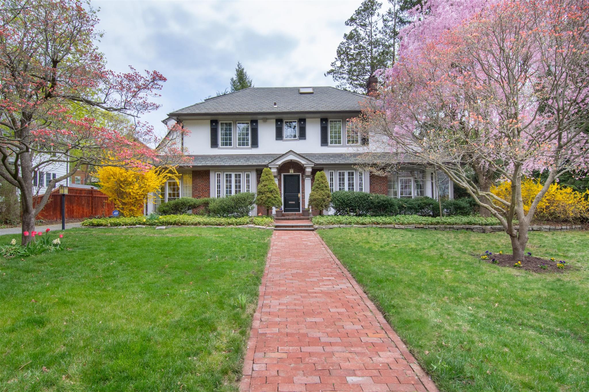 146 Pondfield Road West Bronxville, NY 10708 - Photo 1 of 1 a front view of a house with a yard