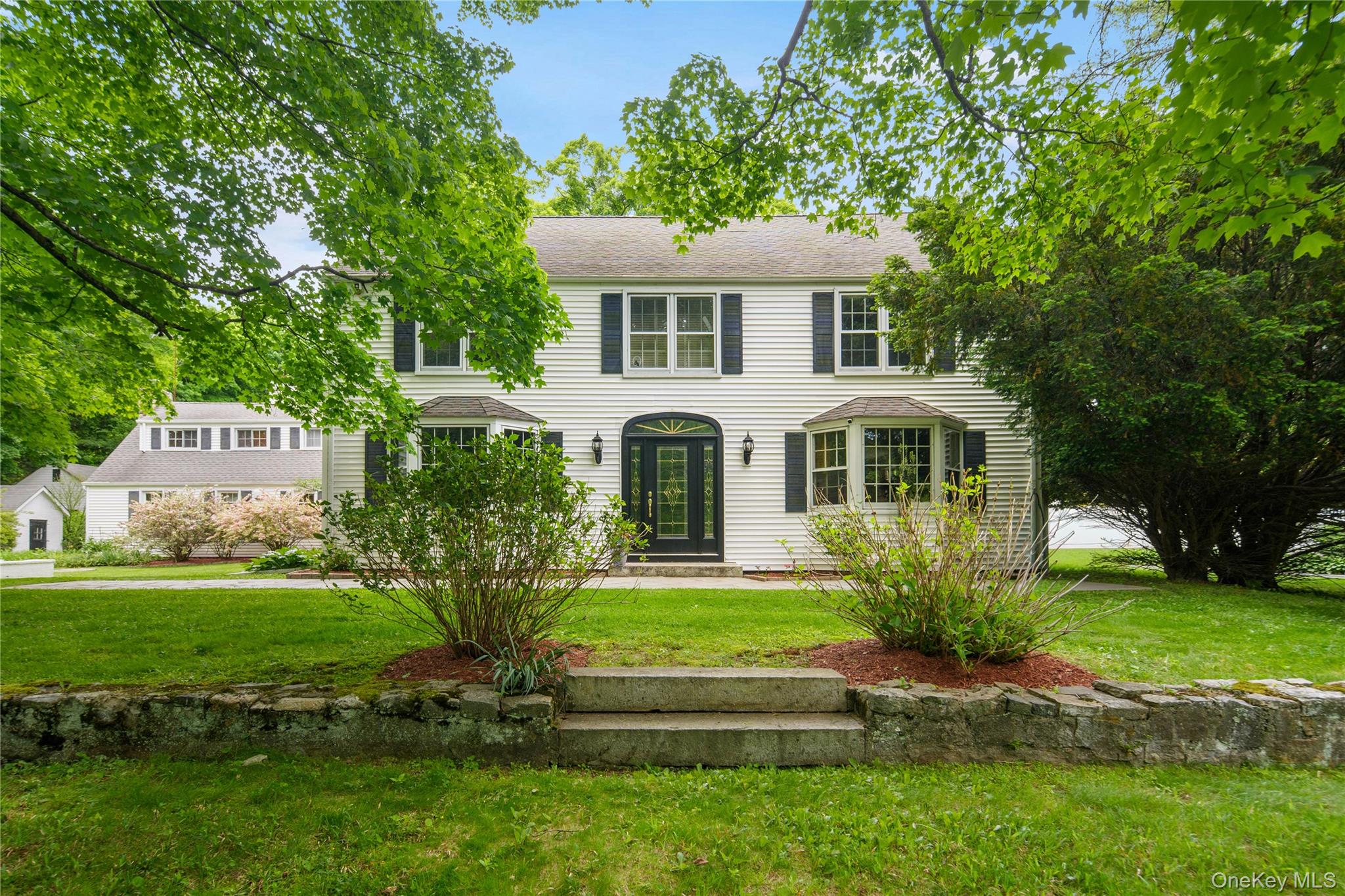 36 Granite Springs Road Granite Springs, NY 10527 - Photo 1 of 49 a front view of a house with a garden
