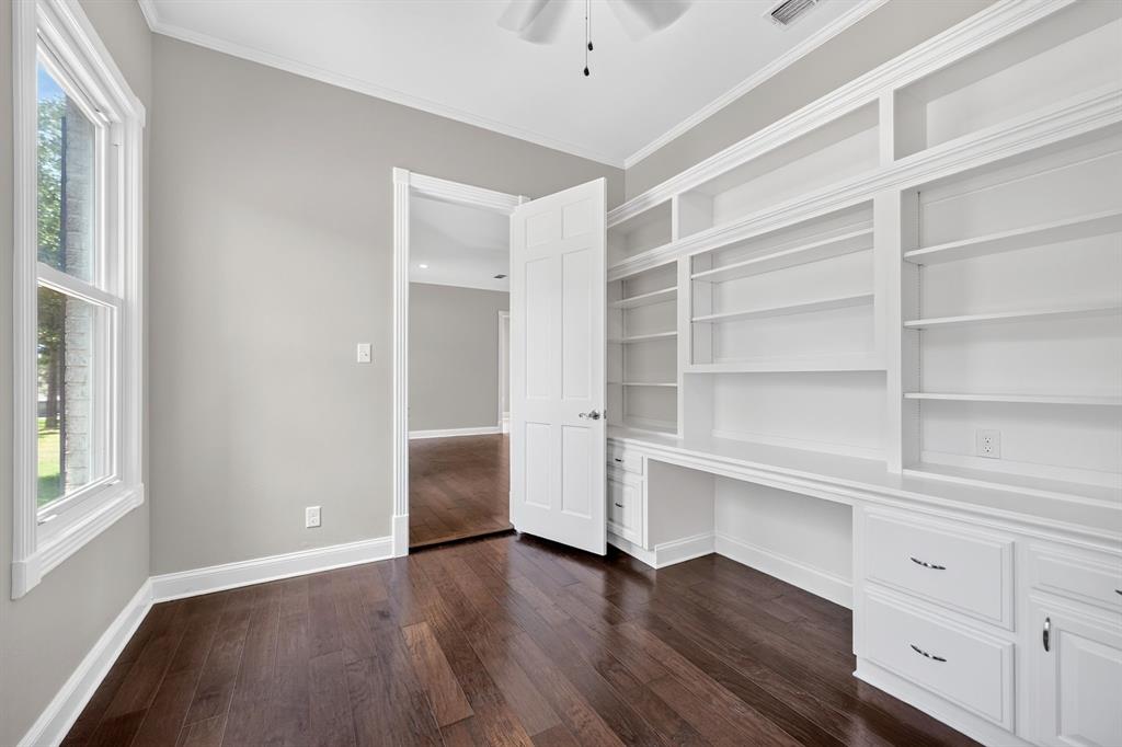 1201 Robbins Road Athens, TX 75751 - Photo 19 of 40 Office connected to primary ensuite featuring built ins for storage & abundant natural lighting.