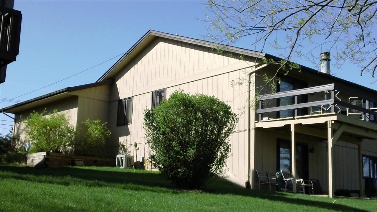 5642 Spring Brook Road Rockford, IL 61114 - Photo 11 of 25 a view of house with backyard and garden