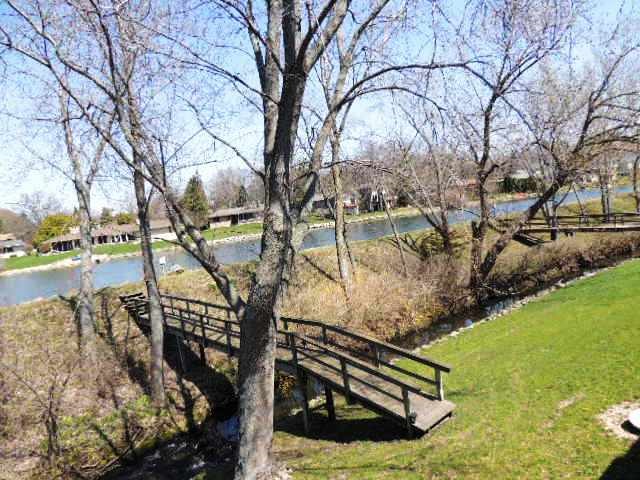 5642 Spring Brook Road Rockford, IL 61114 - Photo 4 of 25 a view of a yard with iron fence
