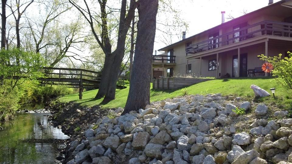 5642 Spring Brook Road Rockford, IL 61114 - Photo 7 of 25 a backyard of a house with lots of green space