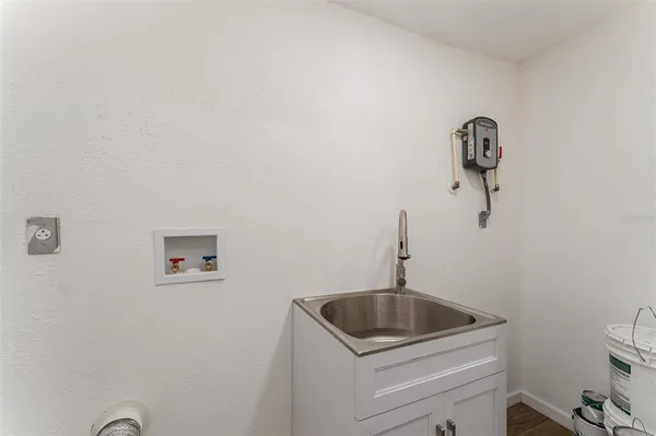 a kitchen with a sink a toilet and vanity
