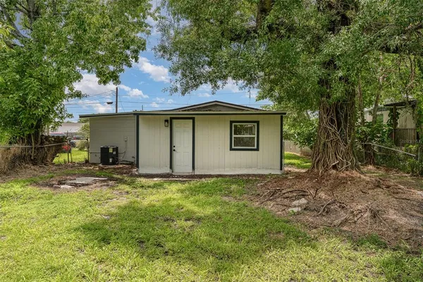 a house with trees in the background