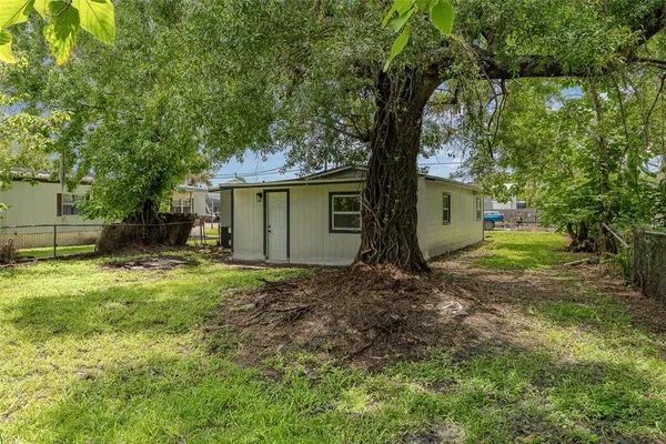 a backyard of a house with lots of green space