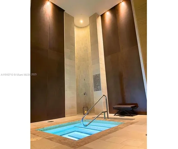 a bathroom with a toilet and shower