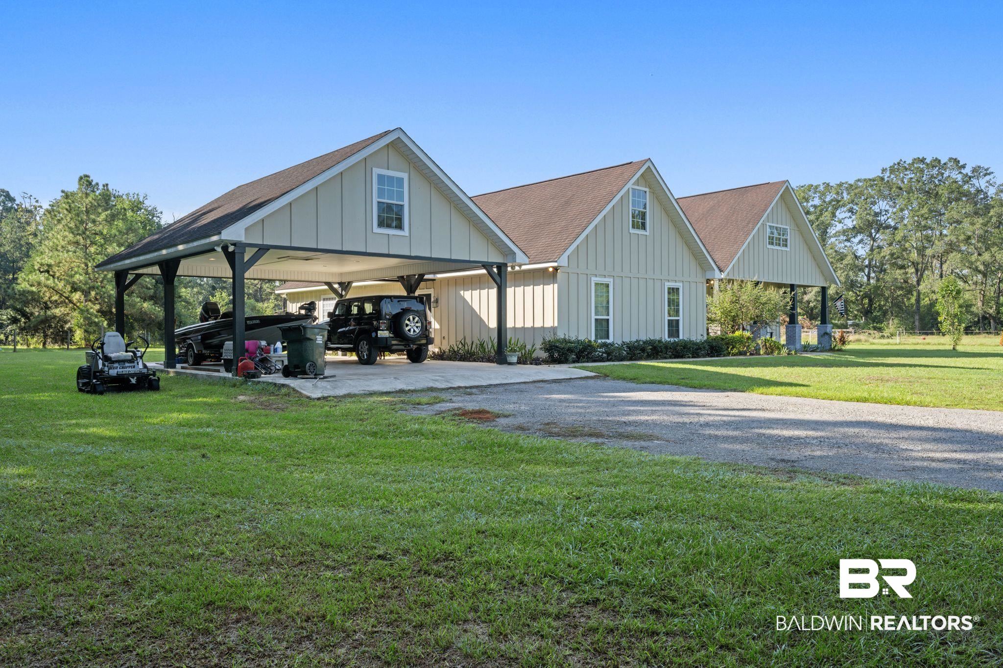15635 North A N Brady Road Bay Minette, AL 36507 - Photo 3 of 51 View of front facade featuring a front yard and a carport