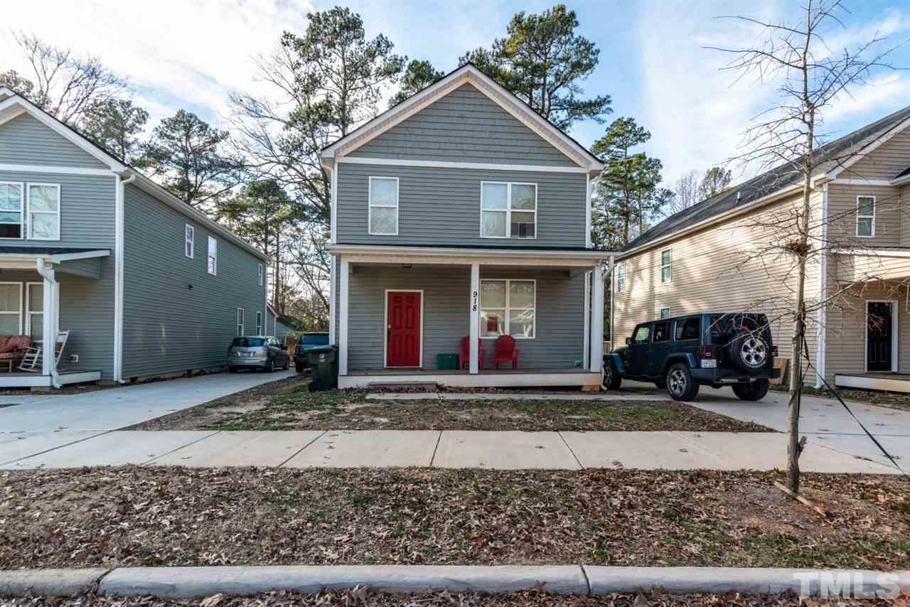 918 Chaney Road Raleigh, NC 27606 - Photo 1 of 4 a front view of a house with a yard and garage