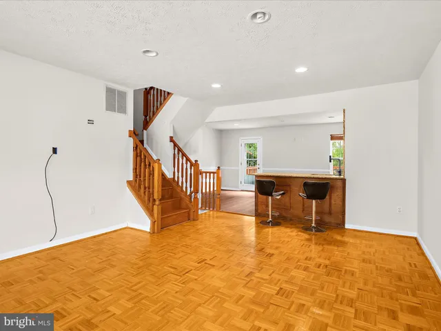 a view of an empty room with furniture