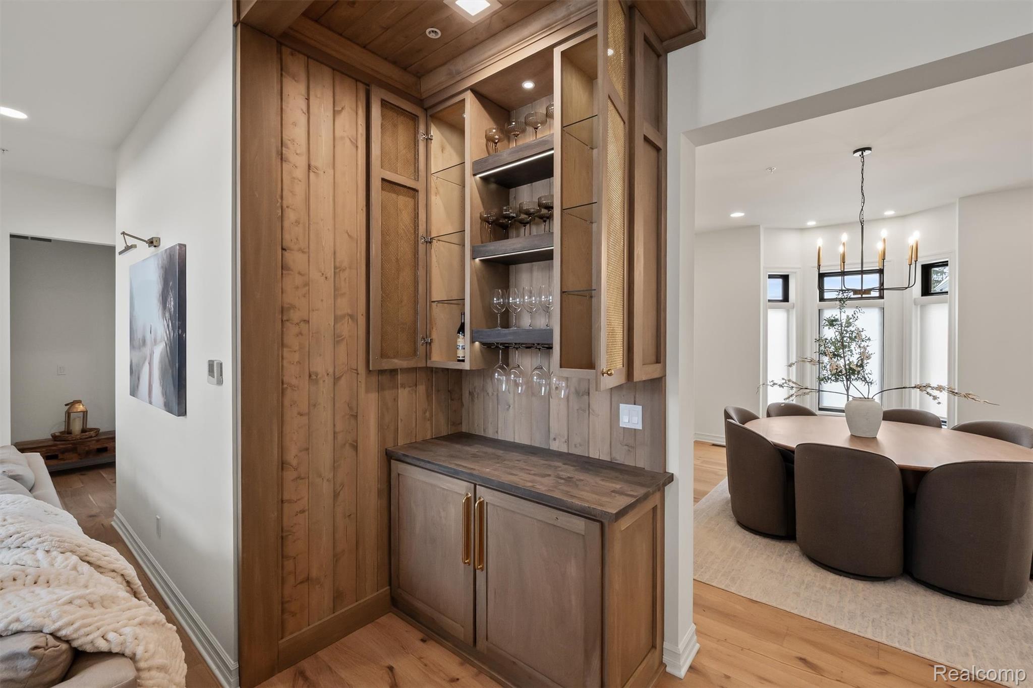 2584 Heights View Court Rochester, MI 48306 - Photo 59 of 60 Kitchen with open shelves, light wood-style flooring, wood finish cabinetry, open floor plan, and a chandelier