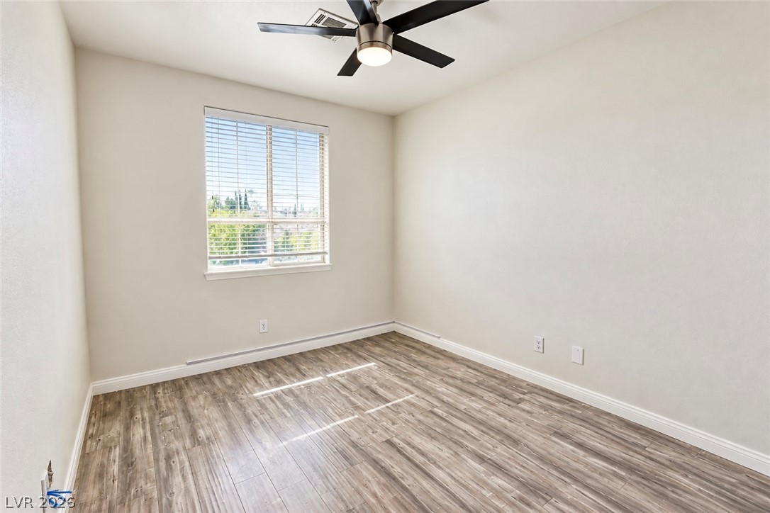 3104 Maple Ridge Court Henderson, NV 89052 - Photo 17 of 25 Gleaming wood-look floors and clean trim define this versatile secondary space.