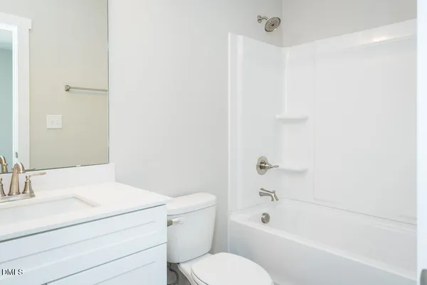 a bathroom with a toilet a sink and a bathtub