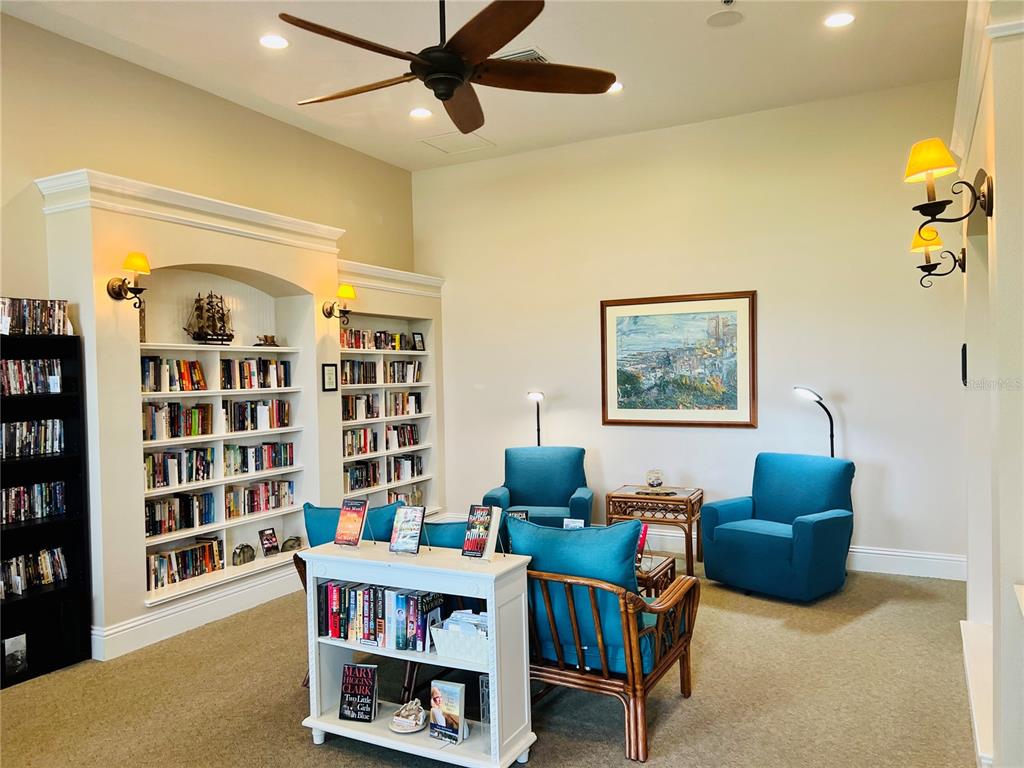 9349 Southeast 49th Terrace Webster, FL 33597 - Photo 20 of 27 a living room with furniture a rug and a window