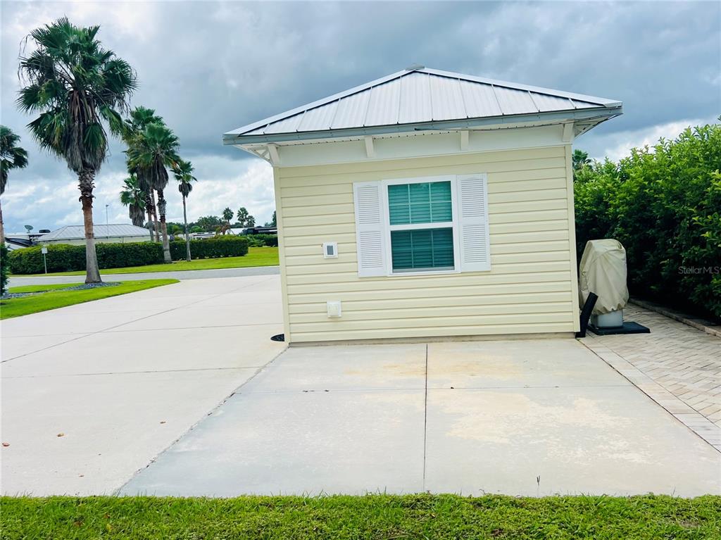 9349 Southeast 49th Terrace Webster, FL 33597 - Photo 5 of 27 a view of a house with a yard and plants