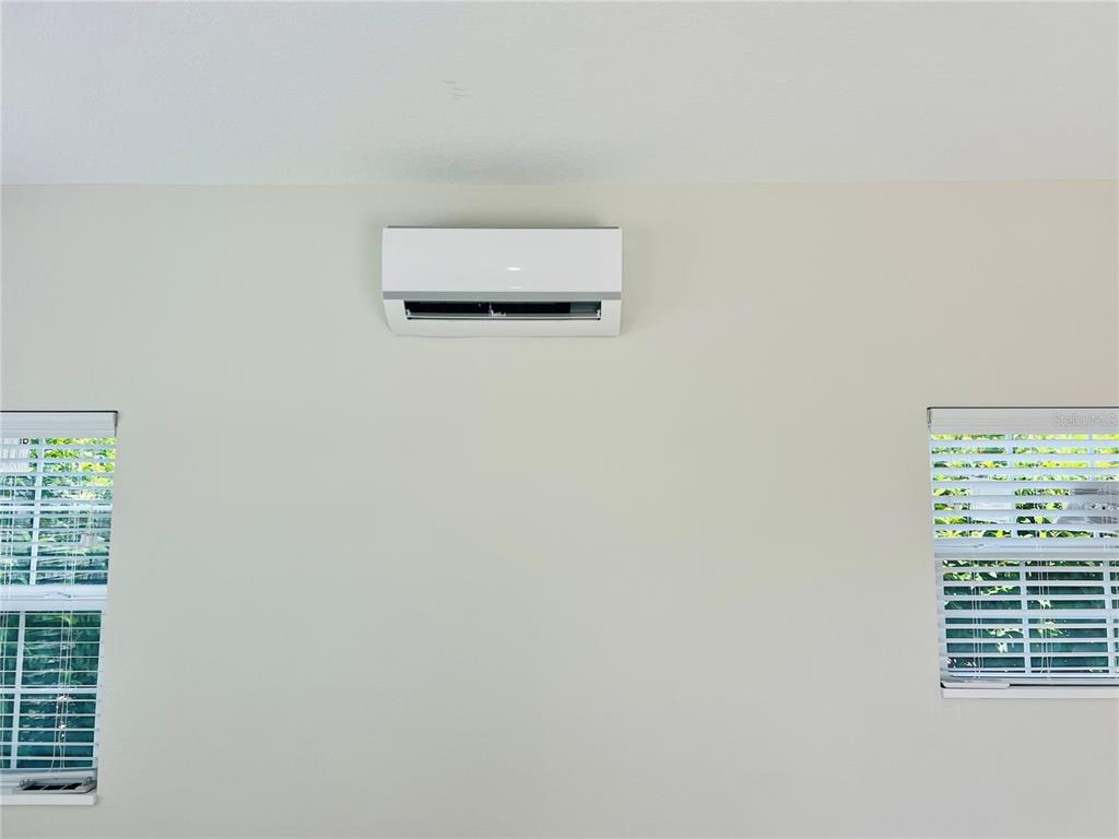 9349 Southeast 49th Terrace Webster, FL 33597 - Photo 9 of 27 a picture of a wall with a window